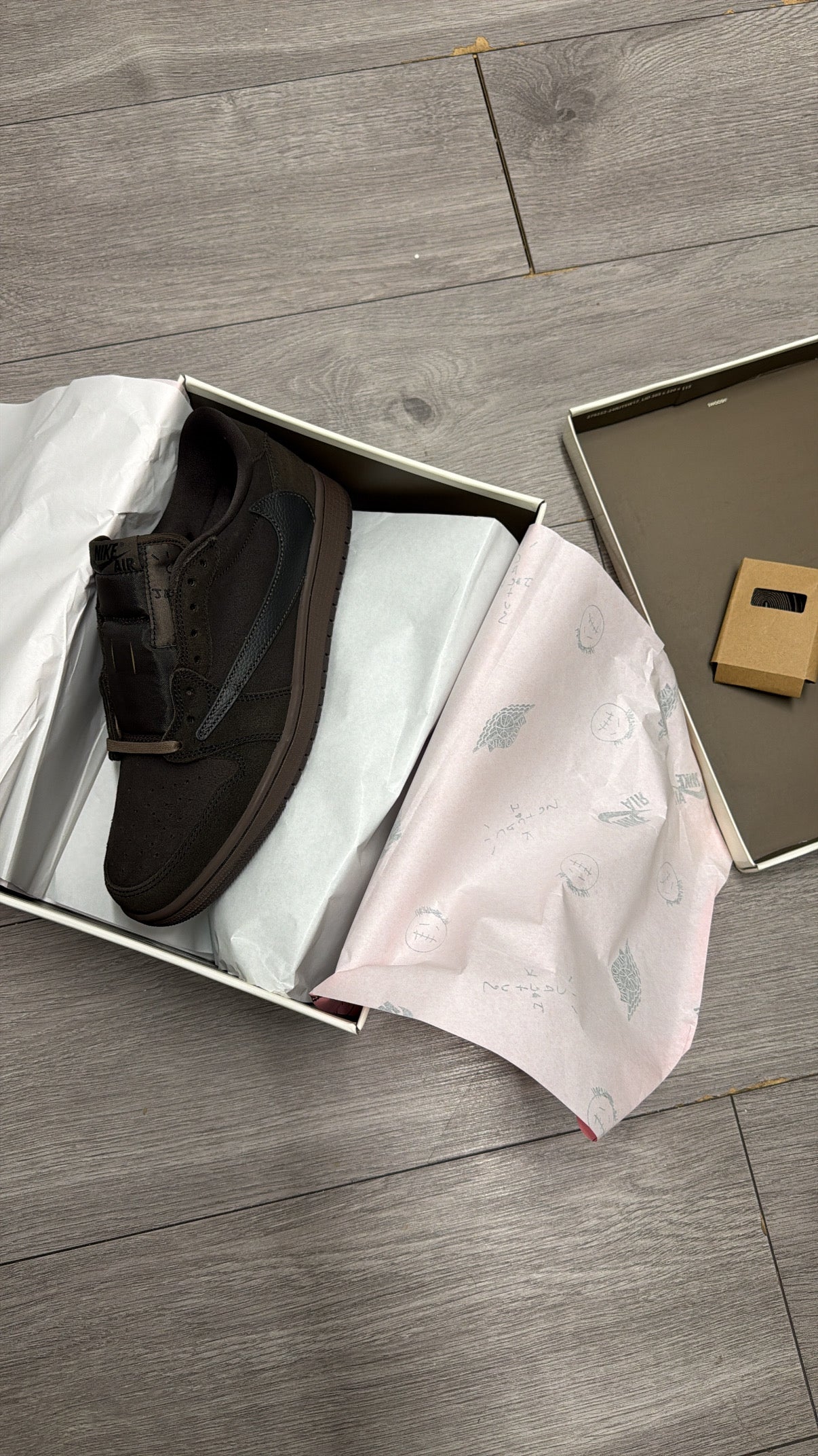 Travis AIR 1s “velvet brown”